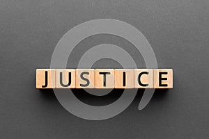 Justice - word from wooden blocks with letters