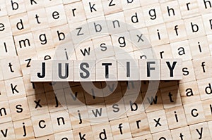 Justify word concept on cubes photo