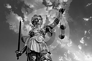 Justitia - Lady Justice . sculpture at the Roemerberg in Frankfurt photo