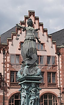 Justitia - Lady Justice sculpture on the Roemerberg square in Frankfurt, Germany photo