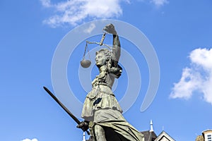 Justitia Lady Justice sculpture on the Roemerberg square in Frankfurt photo