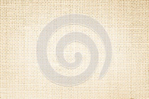 Jute hessian sackcloth burlap canvas woven texture background pattern in light beige cream brown color blank. Natural weaving