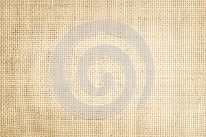 Jute hessian sackcloth burlap canvas woven texture background pattern in light beige cream brown color blank. Natural weaving