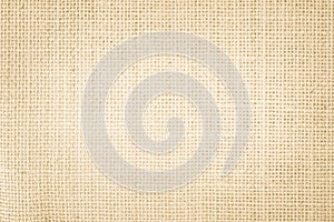 Jute hessian sackcloth burlap canvas woven texture background pattern in light beige cream brown color blank. Natural weaving