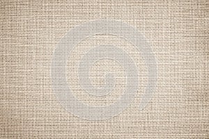 Jute hessian sackcloth burlap canvas woven texture background pattern in light beige cream brown color blank. Natural weaving