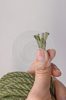 Jute rope from four nets in the hand of a craftswoman