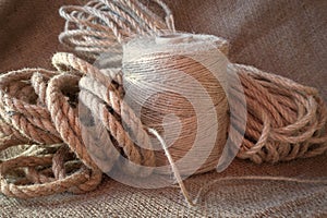 Jute rope and spools of burlap threads or twine