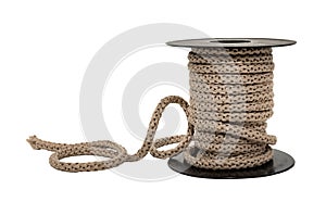 Jute rope is wound on a plastic spool on a white background. Rope isolate