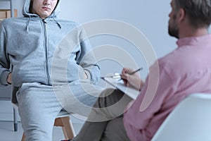 Juvenile offender talking to his curator during a meeting