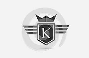 K alphabet letter logo icon for company in black and white. Creative badge design with king crown wings and shield for business