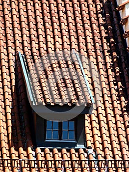 Older brick roof with roof dormer and `monk and nun` - roof tile photo