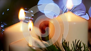 4K Nice CloseUp of Lighted Candles with Christmas Ornament in Slow Motion