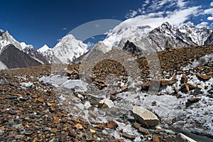 K2 mountain with clouds on top and Baltoro glacier, K2 trek, Pakistan