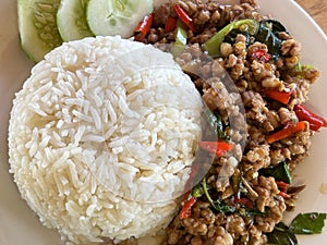 Ka pao Nuea or stir-fry beef spicy with basil leaf  and rice. photo