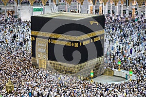 Kaaba Islamic Holy Place. Muslim pilgrims making tawaf around Kaaba during Umra or Hajj photo