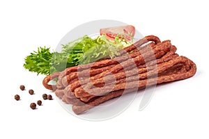 Kabanos. Polish long thin dry sausage made of pork. Isolated on white background
