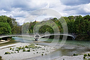 Kabelsteg bridge in Munich over the river Isar with Maximilianeum