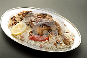 Kabsa with grilled chicken - Mandi - Kabsah - Mandi Rice with Chicken photo