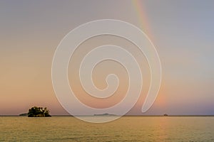 Rainbow over Yenanas beach, Kabui Bay, Gam island, Raja Ampat - West Papua, Indonesia photo