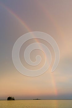 Rainbow over Yenanas beach, Kabui Bay, Gam island, Raja Ampat - West Papua, Indonesia photo