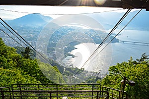 Kachi Kachi Ropeway going up to mount Tenjo Yama`s peak towards lake Kawaguchiko