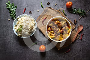 Kadhi chawal an Indian delicacy prepared with rice by putting fried fritters