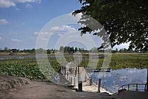 Kae Dam long wooden bridge for thai people and foreigner travelers walking travel and visit at Maha Sarakham, Thailand