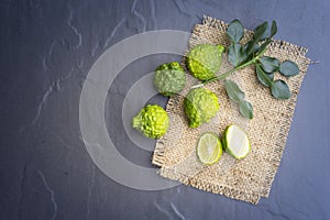 Kaffir lime on black background is fruits and leaves are used as a spice