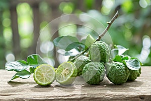 Kaffir lime with leaves on wooden background. photo