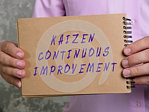 KAIZEN CONTINUOUS IMPROVEMENT sign on the piece of paper