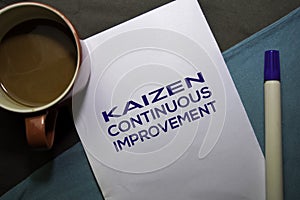 KAIZEN. Continuouse Improvement text on the paper isolated on office desk background. Japanese Concept