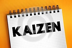 Kaizen - Japanese term meaning `change for the better` or `continuous improvement, text concept on notepad