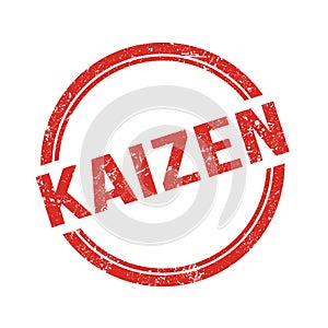 KAIZEN text written on red grungy round stamp