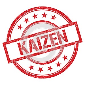 KAIZEN text written on red vintage stamp