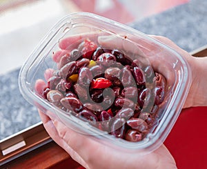 Kalamata or Kalamon purple Greek olives contained in a plastic tray