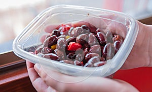 Kalamata or Kalamon purple Greek olives contained in a plastic tray