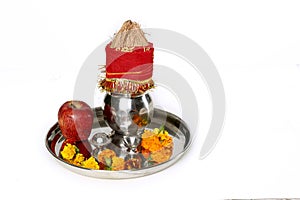 Kalash with coconut and chunni and pooja thali with diya for navratri pooja