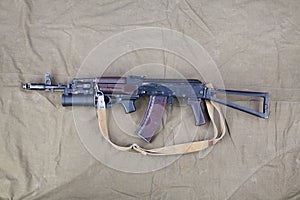 Kalashnikov AK 74 with underbarrel grenade launcher on canvas