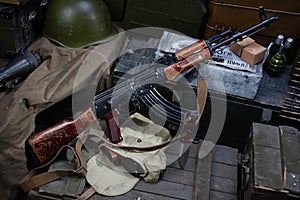 Kalashnikov AK 47 with ammunitions on army box background