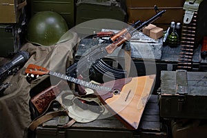 Kalashnikov AK 47 with ammunitions on army box background