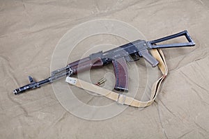 Kalashnikov AK 74 with ammunitions on canvas photo