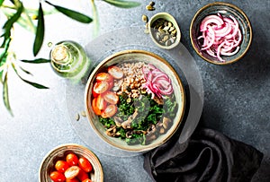 Kale and buckweat vegan bowl with marinated onion