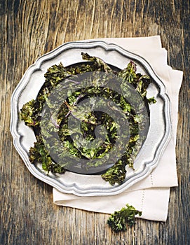 Kale chips with sea salt on baking tray