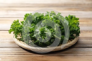 Kale in a colander placed against a wooden background