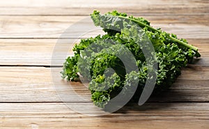 Kale placed against a wooden background