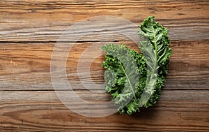 Kale placed against a wooden background