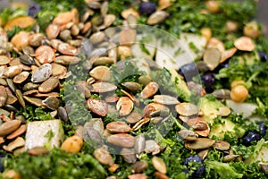 Kale salad in silver salad bowl full frame