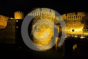 Kalemegdan fortress wooden bridge, gates and towers at night in Belgrade