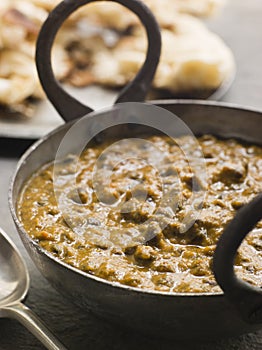 Kali Dahl Served in a Karahi With Naan Bread photo