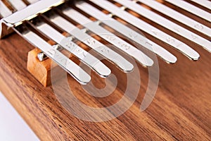 Kalimba or Mbira is an African musical instrument close up on white background. Music concept